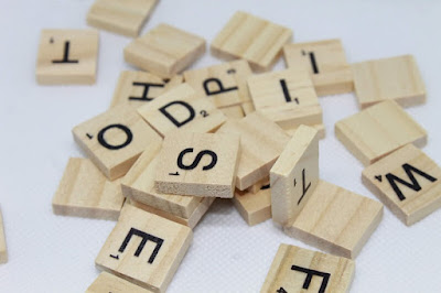 Wooden letter tiles mixed up