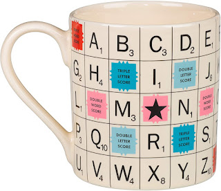 Coffee mug with a Scrabble board printed onto the entire mug.